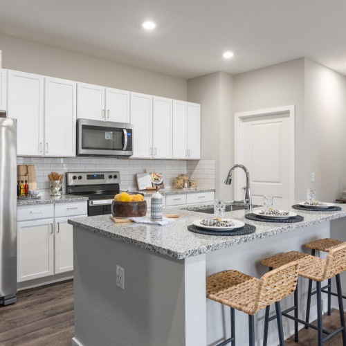 Kitchen with Stainless-Steel Appliances island seating in kitchen with recessed lighting
